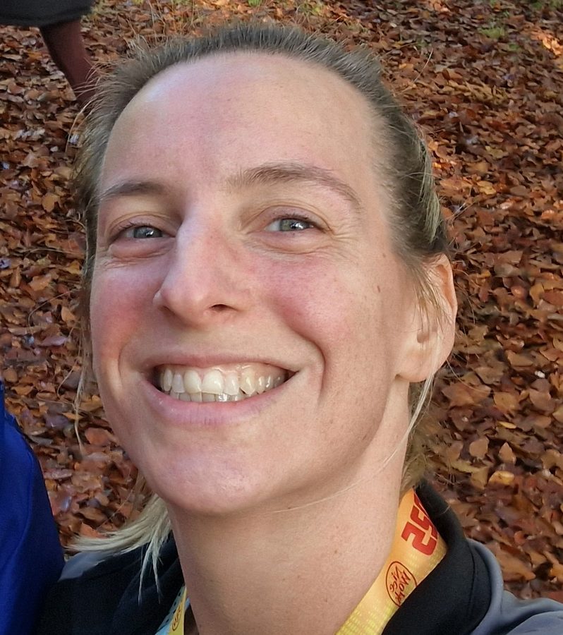 Portrait of Nic, smiling outdoors